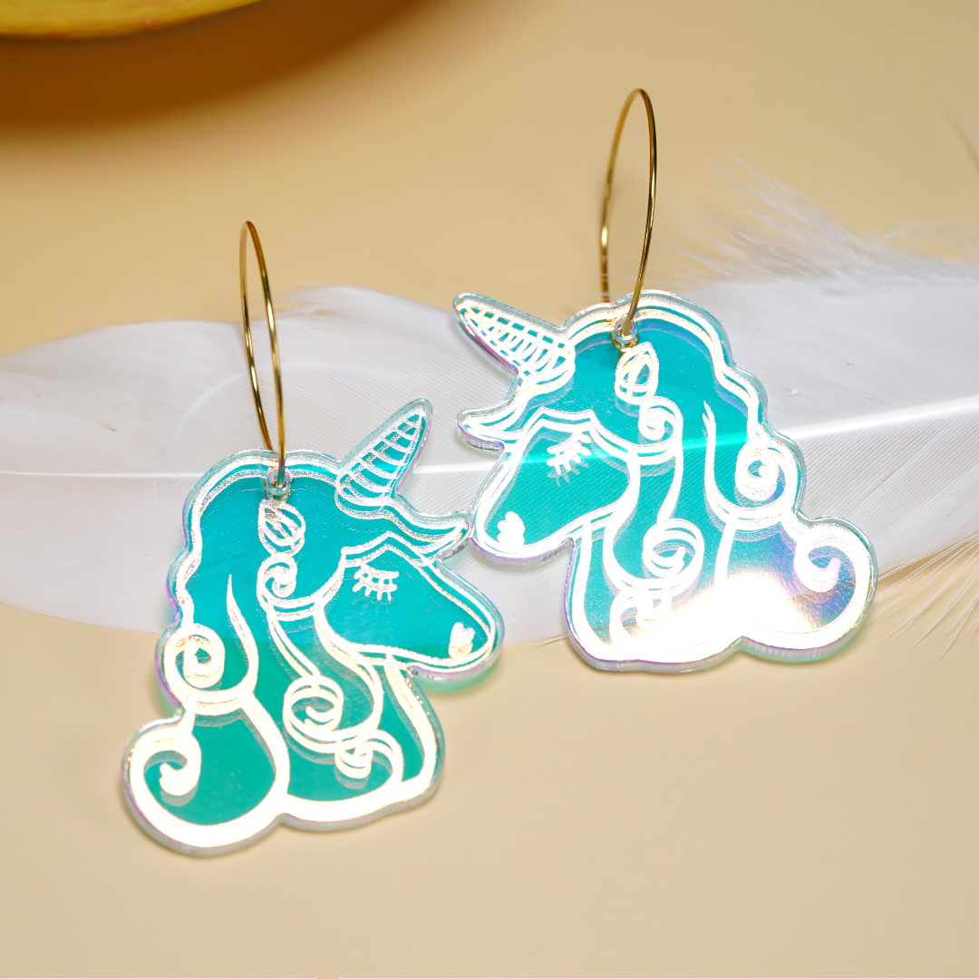 Laser-cut iridescent acrylic unicorn earrings with engraved details, handmade in Melbourne