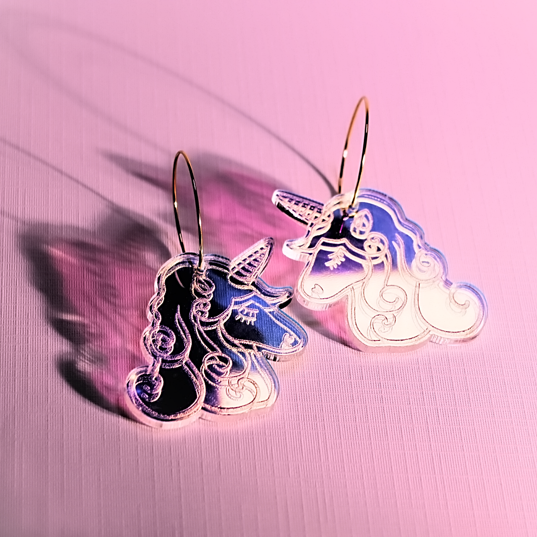 Laser-cut iridescent acrylic unicorn earrings with engraved details, handmade in Melbourne