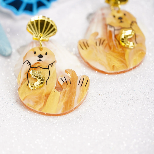 Japanese sea otter with little gold shrimp earrings