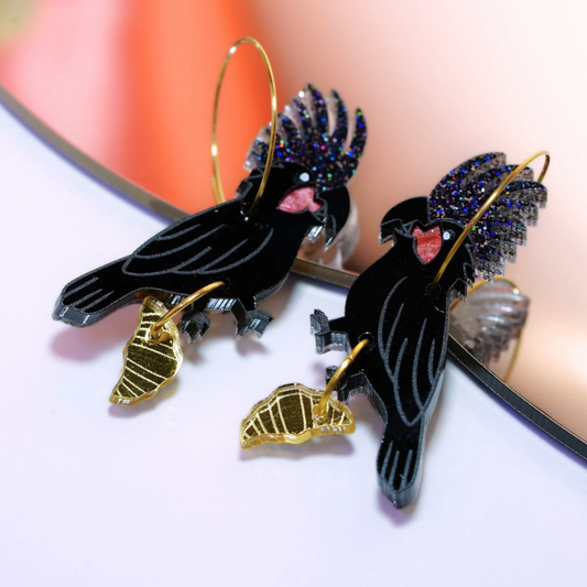 Palm cockatoo and croissant earrings