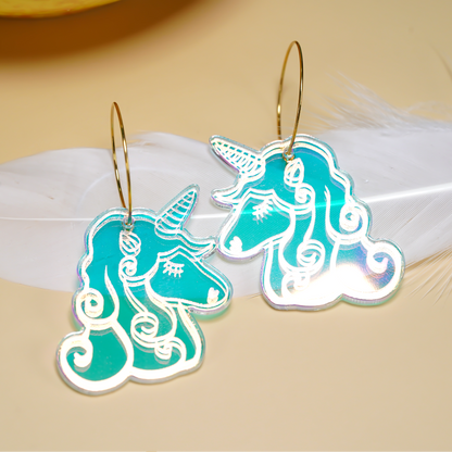 Laser-cut iridescent acrylic unicorn earrings with engraved details, handmade in Melbourne
