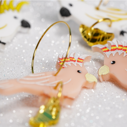 Major Mitchell's cockatoo with croissant gold hoop earrings