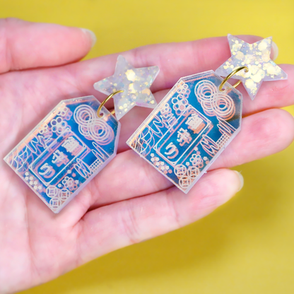 Handmade Hoshi no Omamori earrings inspired by Japanese good luck charms, made from iridescent acrylic and glitter resin in Melbourne
