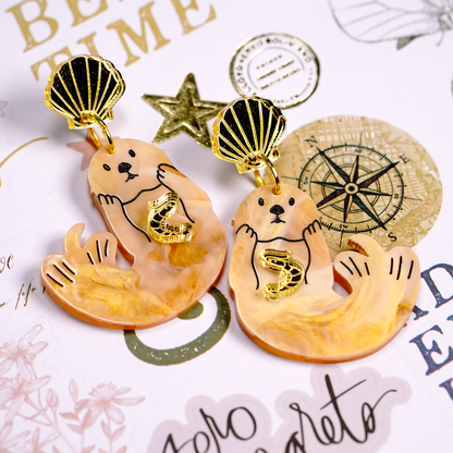 Japanese Sea Otter Earrings with gold shrimp, hand-painted otter design on gold marble acrylic, with seashell tops, handmade in Melbourne
