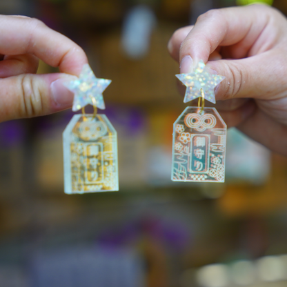 Handmade Hoshi no Omamori earrings inspired by Japanese good luck charms, made from iridescent acrylic and glitter resin in Melbourne
