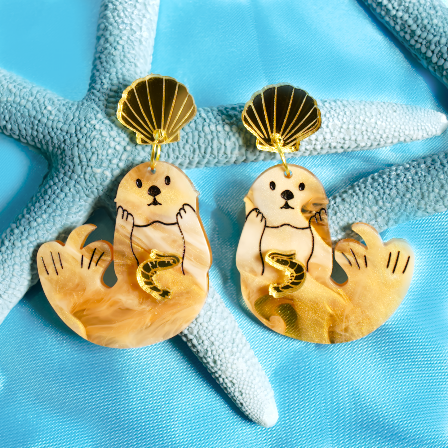 Japanese sea otter with little gold shrimp earrings