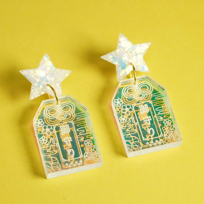 Handmade Hoshi no Omamori earrings inspired by Japanese good luck charms, made from iridescent acrylic and glitter resin in Melbourne
