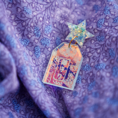 Handmade Hoshi no Omamori earrings inspired by Japanese good luck charms, made from iridescent acrylic and glitter resin in Melbourne
