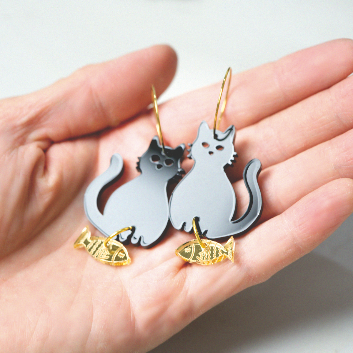 Acrylic black cat and gold fish earrings